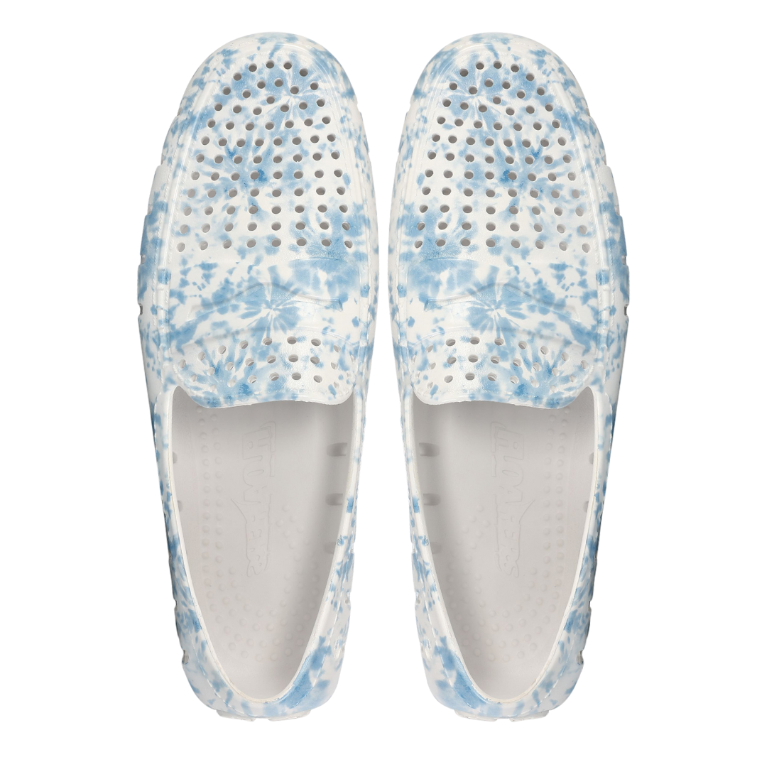 Pair of blue and white patterned shoes on a white background