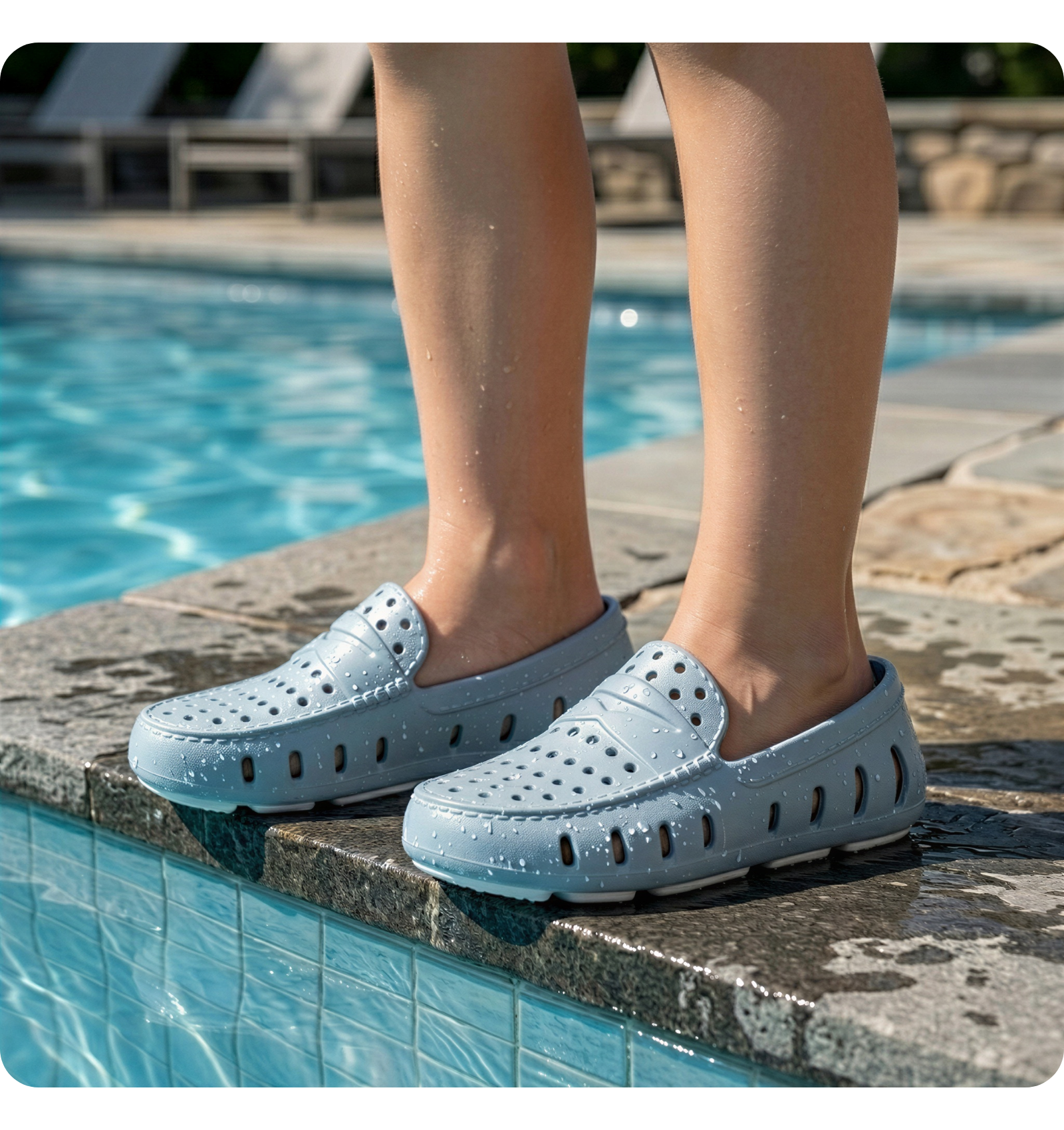 Kids wearing blue Floafers by the pool