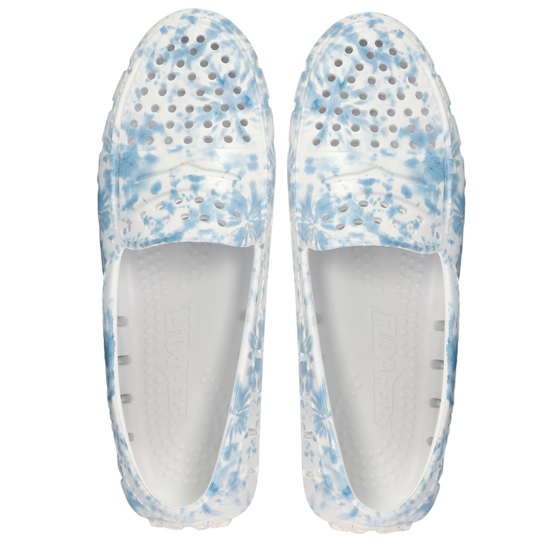 Pair of white shoes with blue floral pattern on a white background